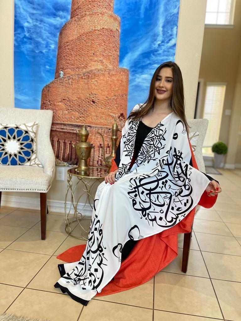 Beautiful white and orang l Colored Bisht with Arabic letters.